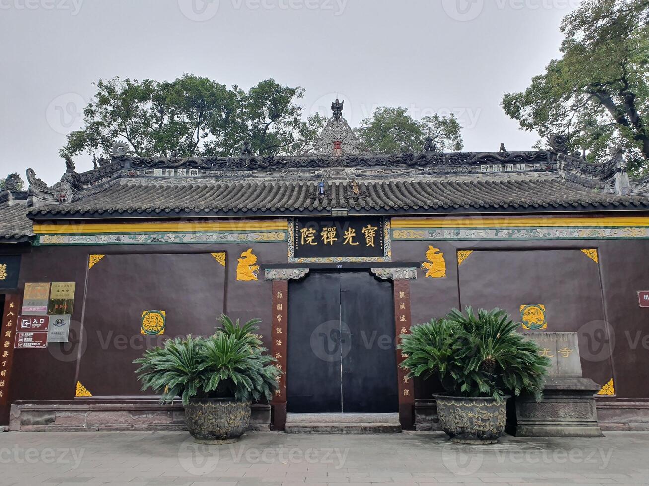 the entrance to a chinese temple with a large building photo