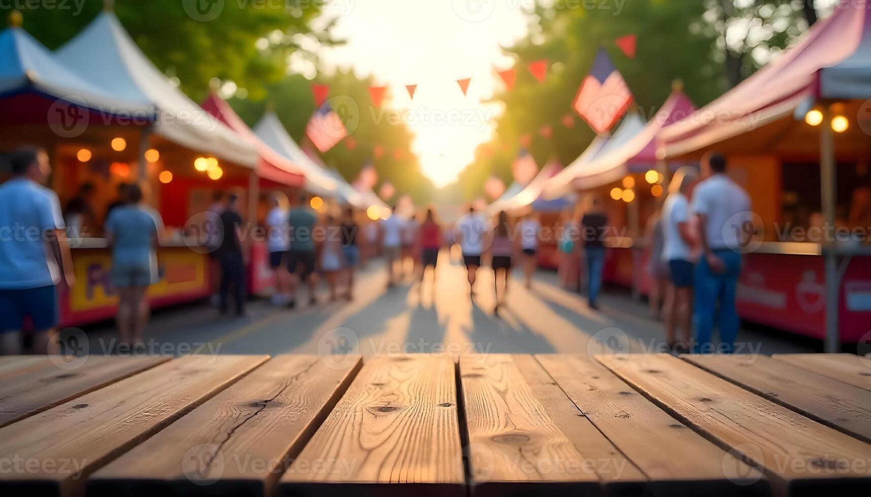Market stalls and sunlight streaming through trees on 4th of july, wooden table for display products photo