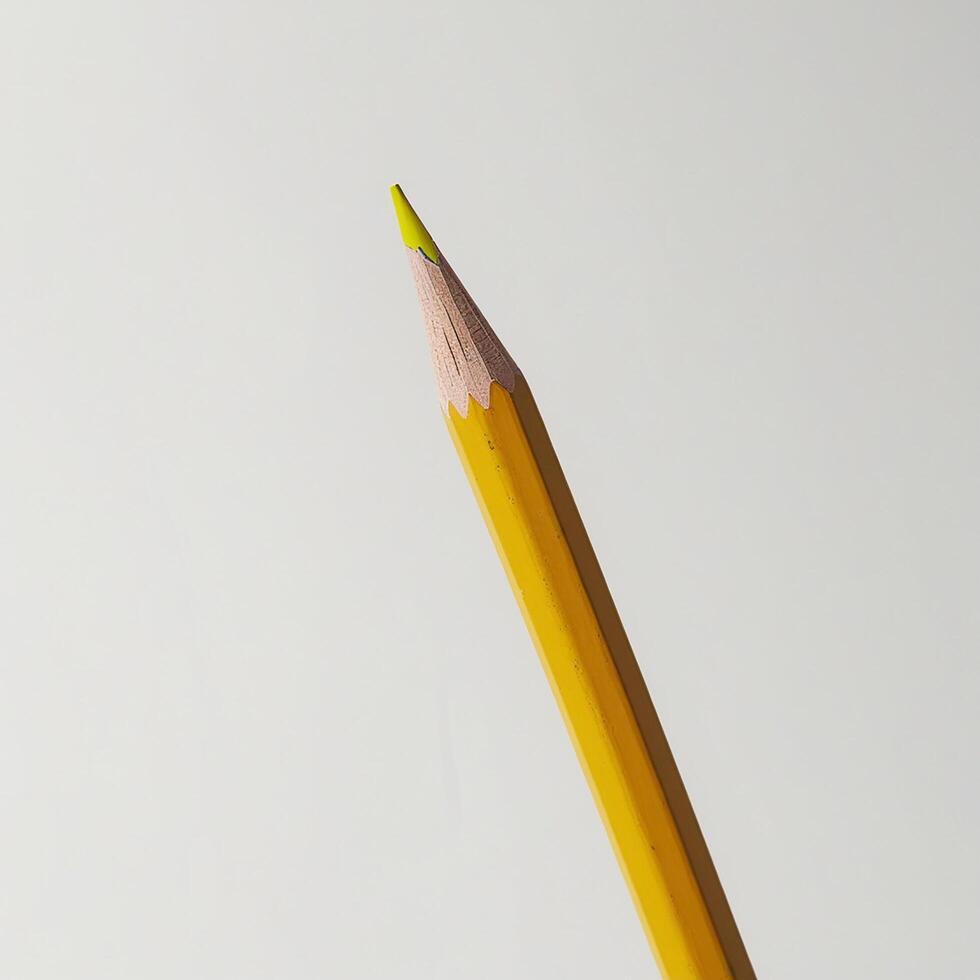 A yellow pencil with a green tip photo