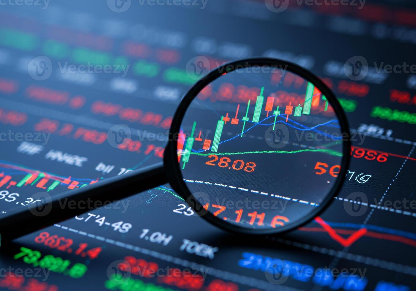 Business Audit and Stock Market Analysis with Magnifying Glass photo