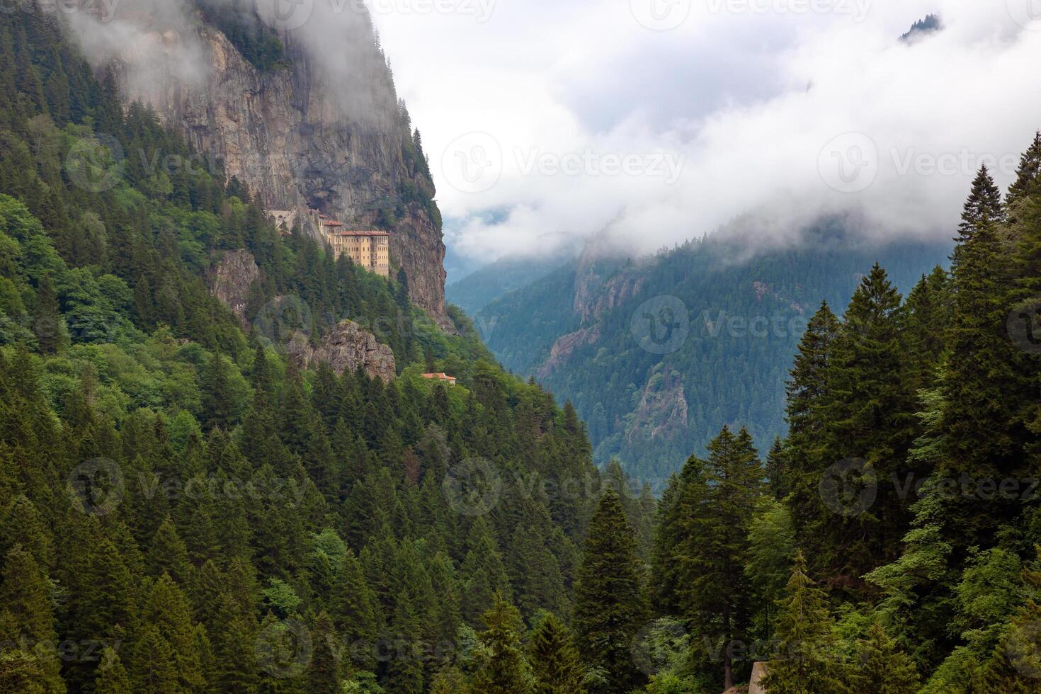 Altindere National Park and Sumela Monastery with misty mountains on background photo
