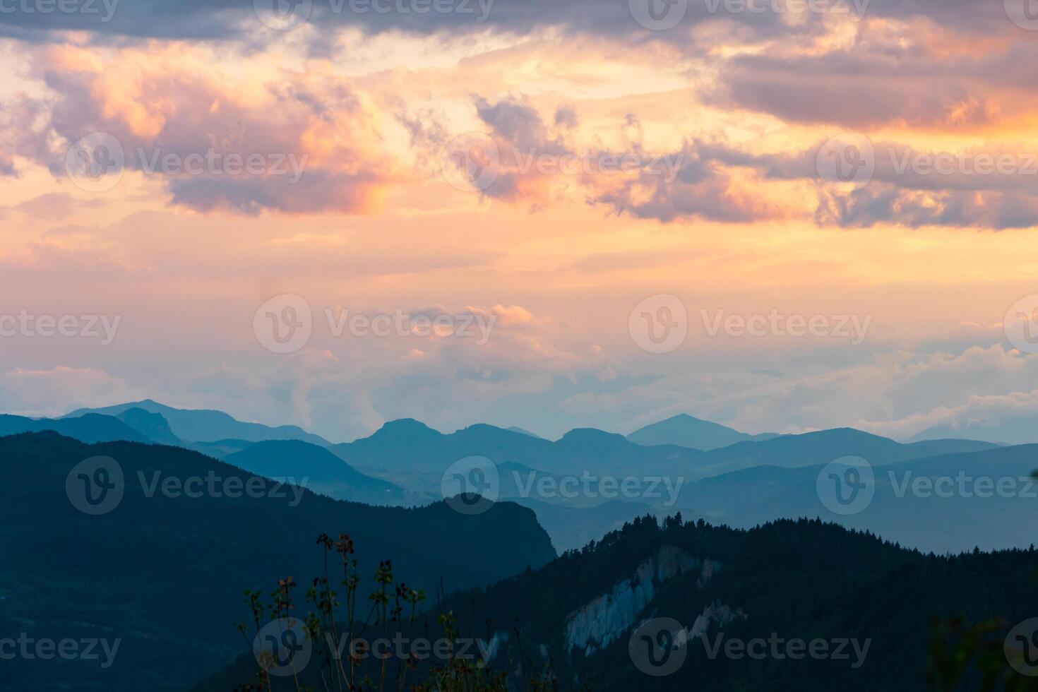 Landscape of the mountain range and partly cloudy sky. photo