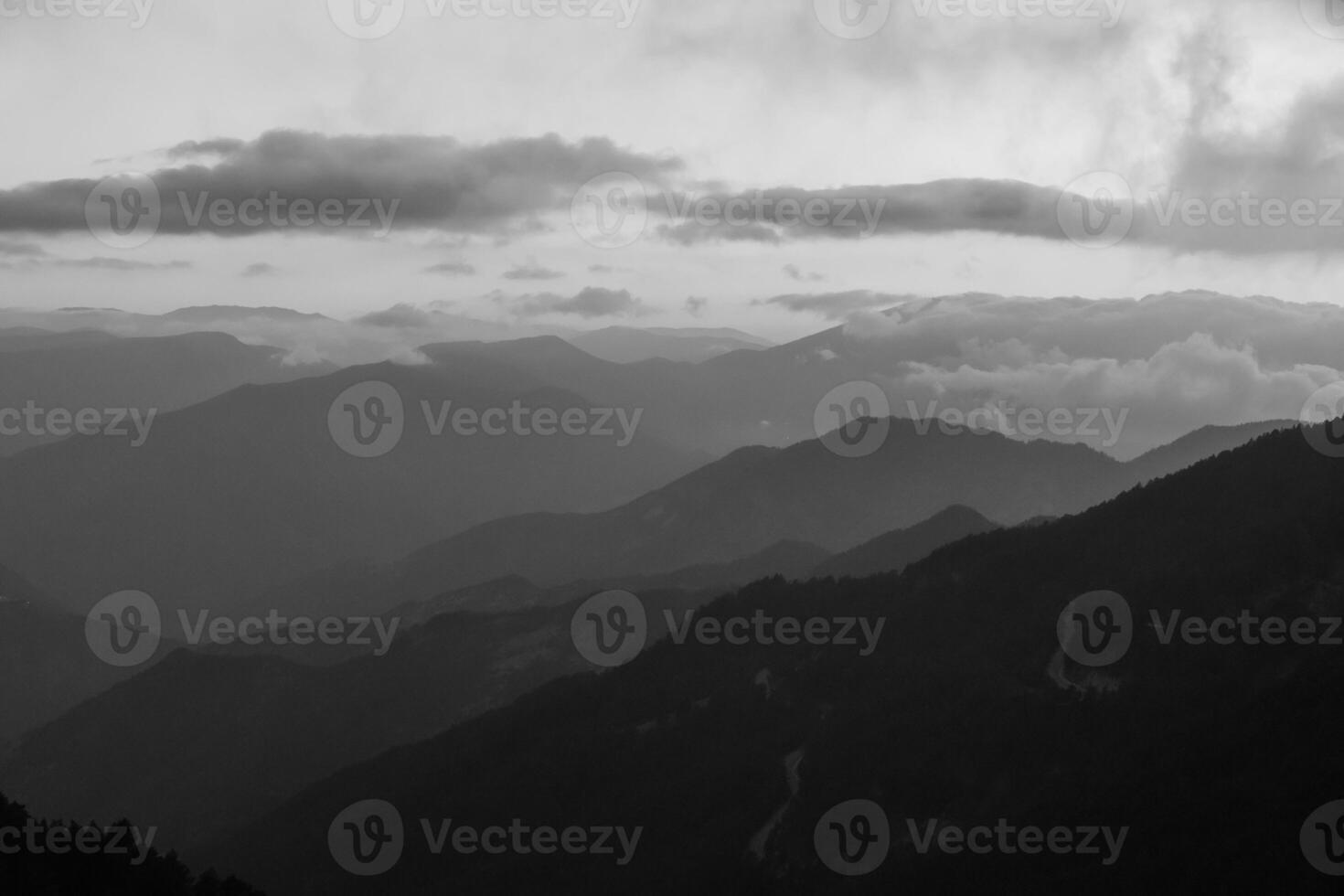 Mountains with fog. Landscape of the mountains in black and white photo