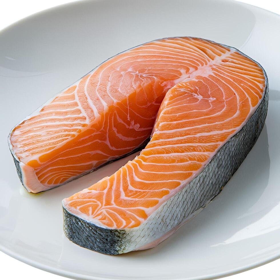 Fresh salmon fillet on white plate vibrant orange hues detailed texture healthy seafood photo