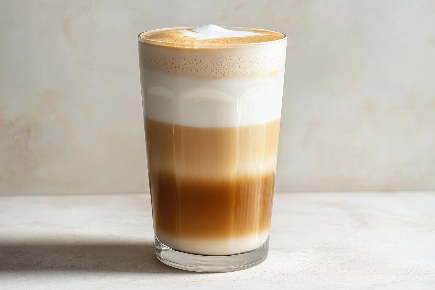 A tall glass of coffee with whipped cream photo