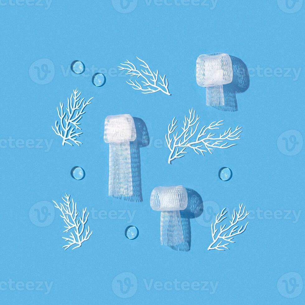Pattern with sea animals jellyfish and corals from plastic underwater, creative flat lay pollution ocean, microplastics pollution ecology problem. Environmental issue, plastic pollution concept. photo