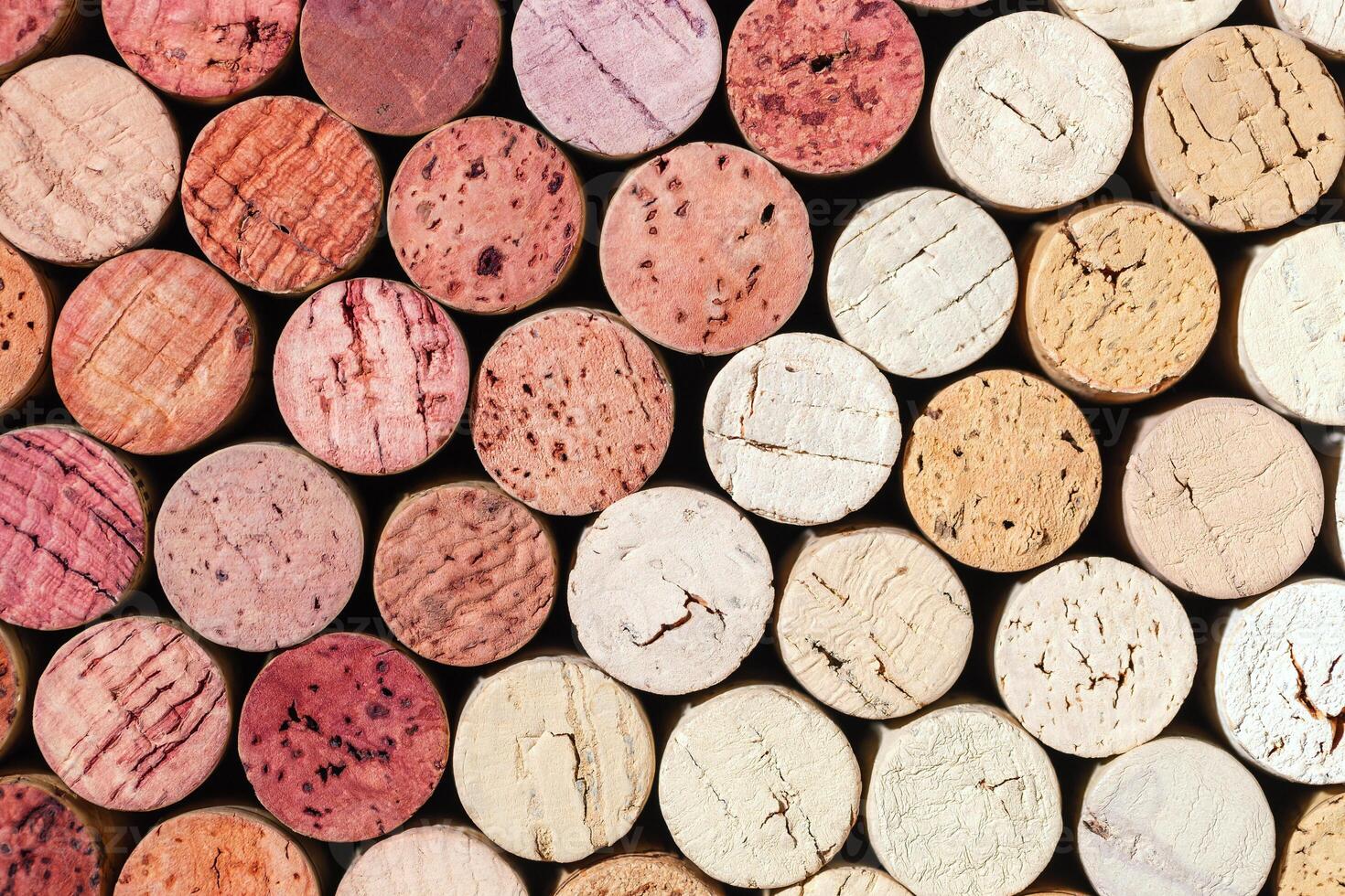 Collection of wine cork from white and red wine, natural texture bottle stoppers top view, colorful background from closeup wooden corks. Natural textured stoppers Winery, winemaking concept photo