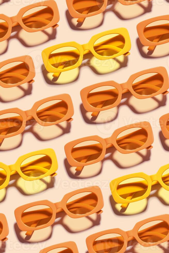 Pattern of Trendy sunglasses with Yellow orange Frame on peach background, beach vibes, summertime mood, sunlight shadow, Summer vacation, summer rest concept. Minimal style layout of eyeglasses photo