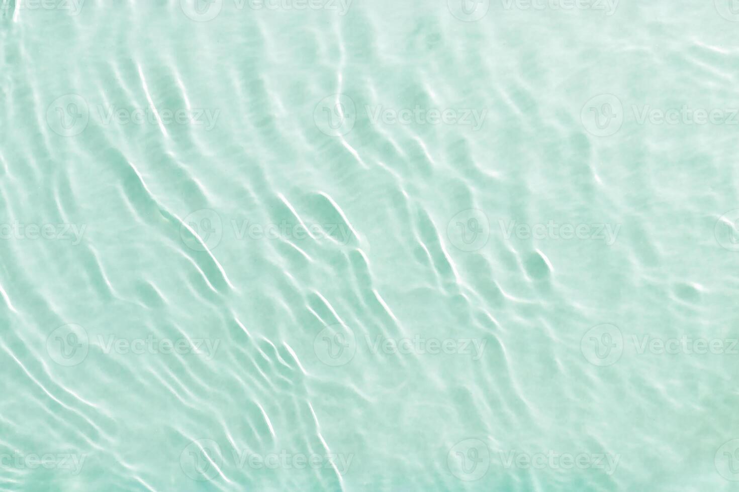Clear water and waves at sunlight, sun flare and bright white reflections on blue, turquoise water surface. Summer vivid gradient color, graphic nature, dynamic aquatic ripples pattern, aesthetic, photo