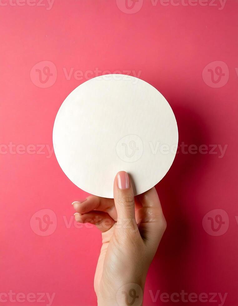 Clean Design Element White Disc in Hand Over Pink photo