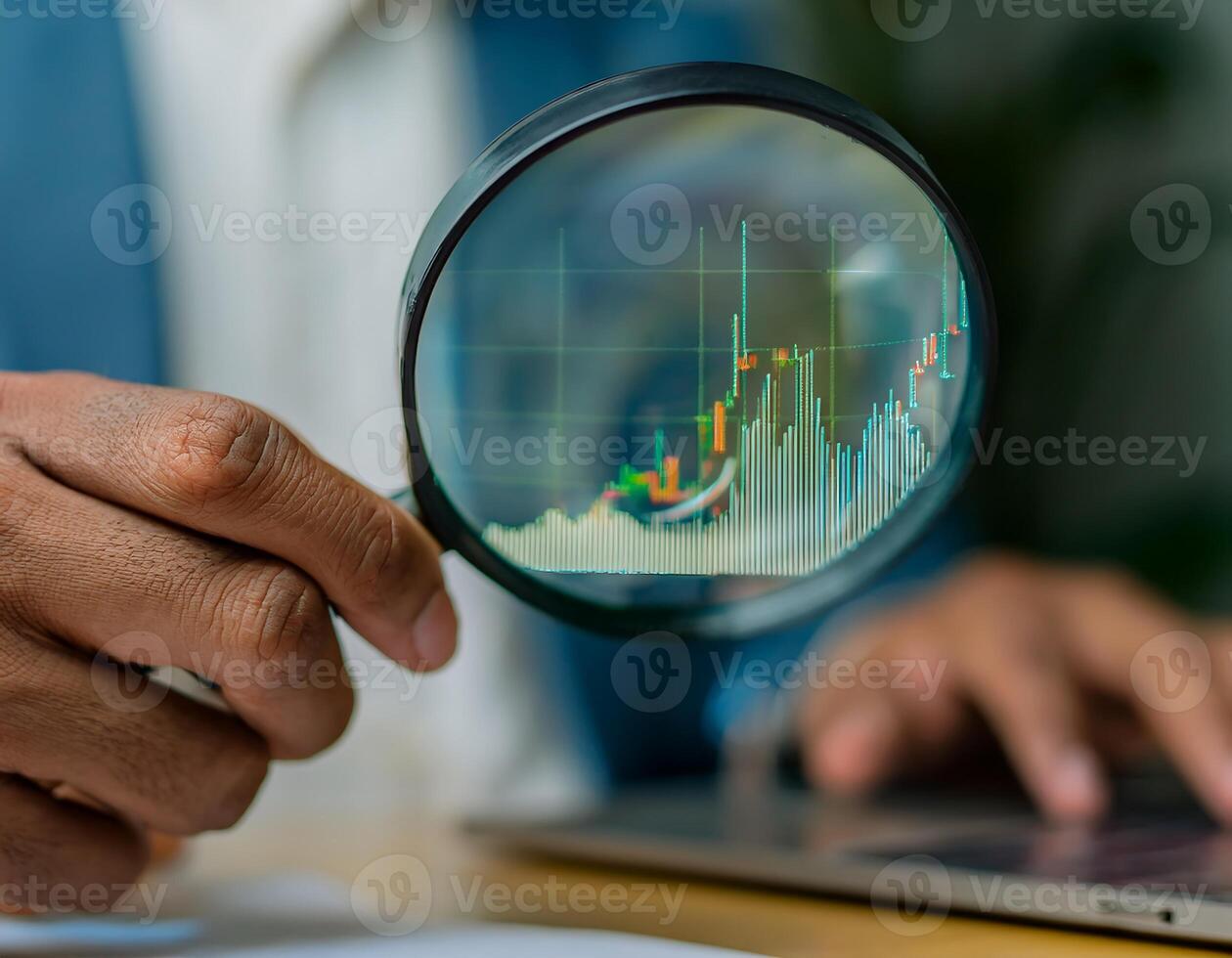 Close-up of a Financial Analyst Studying Stock Charts photo