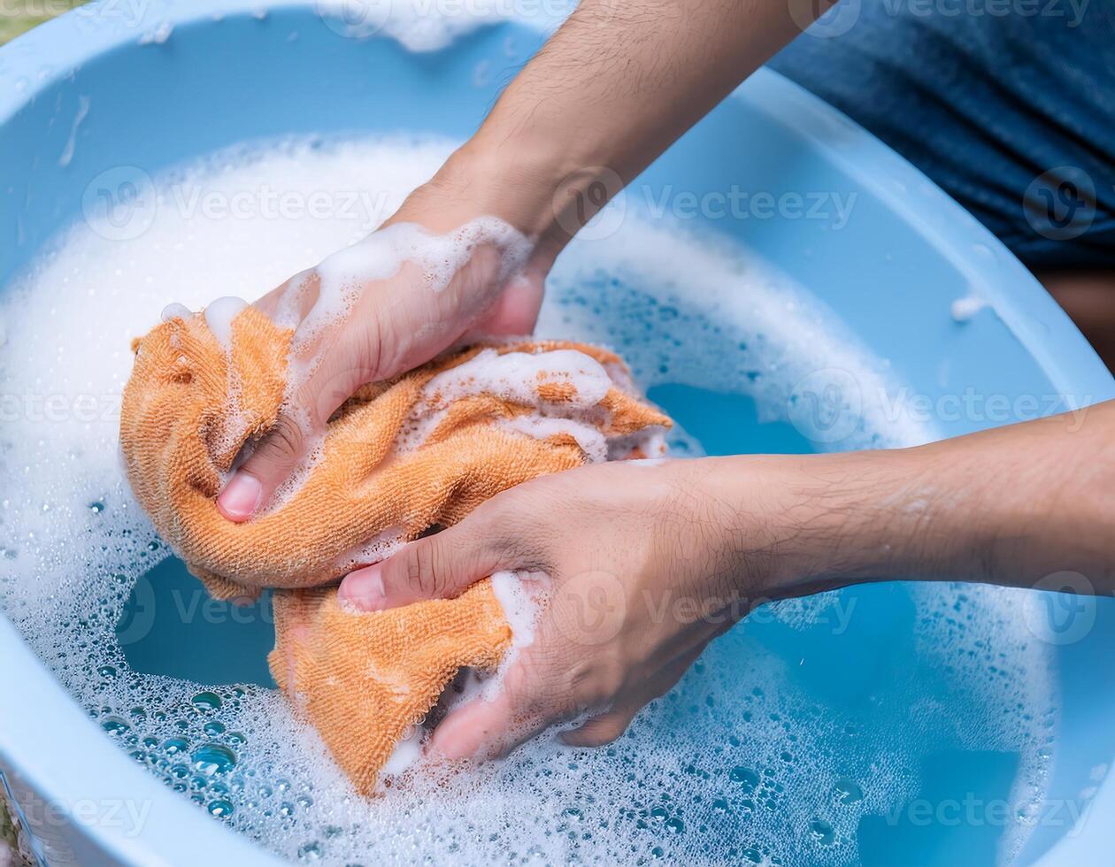 Soapy Bubbles as Hands Scrub Colorful Fabric photo