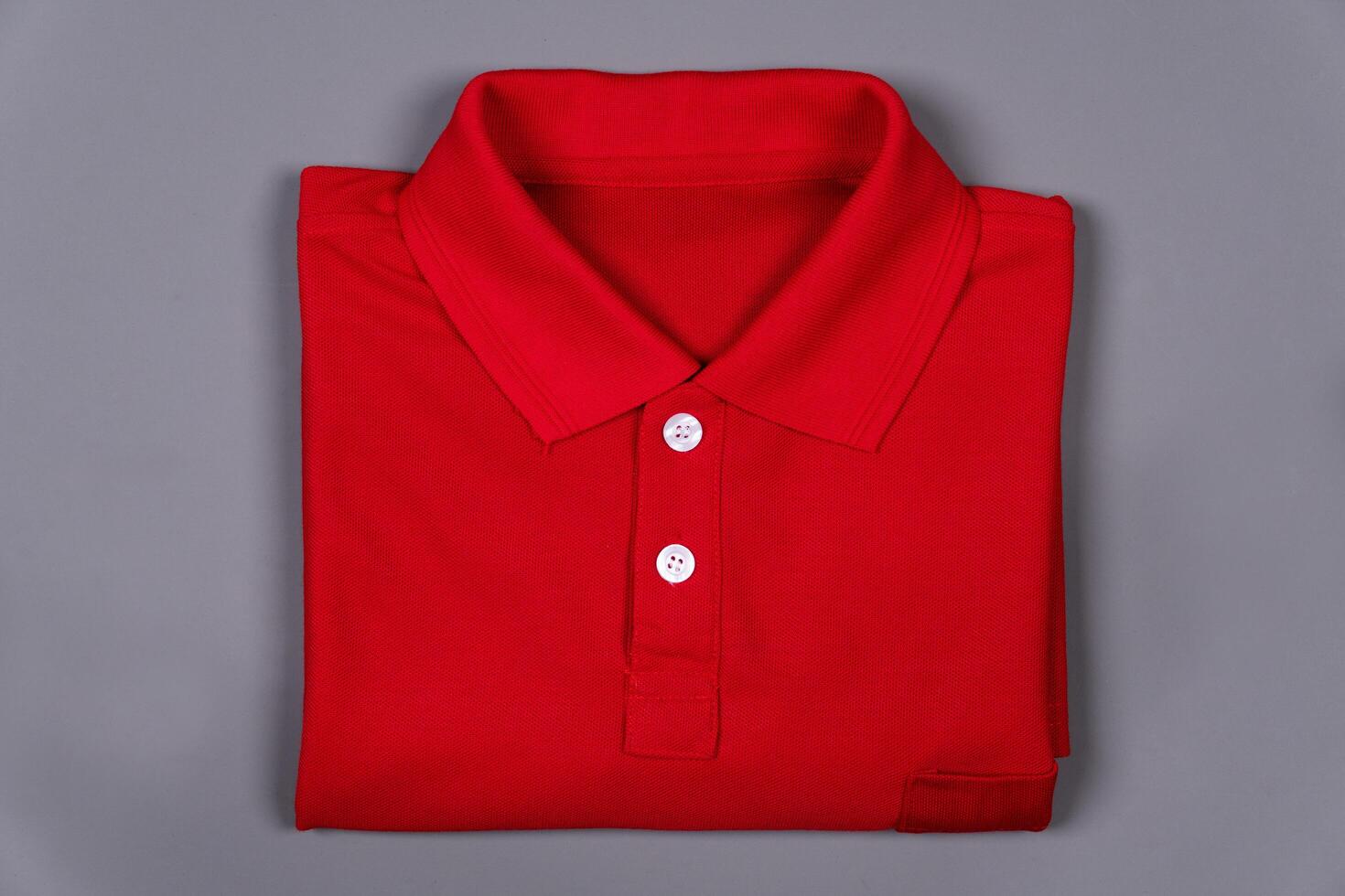 Red folded collar t-shirt on a grey background photo