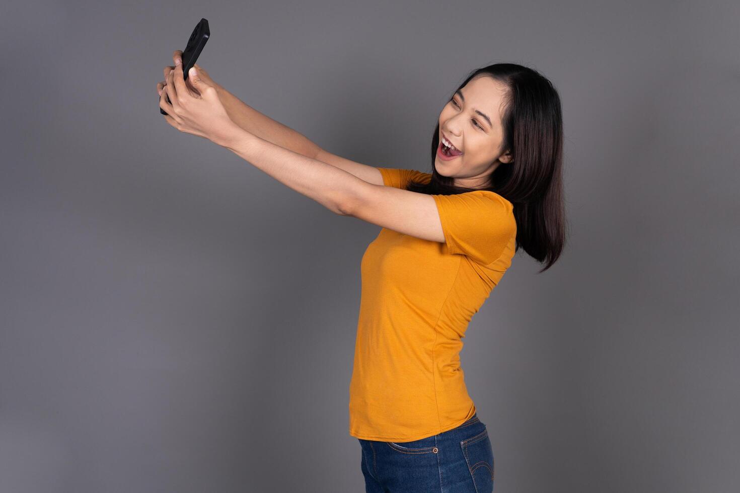 Close-Up of a Woman Smiling Happily While Taking a Selfie photo