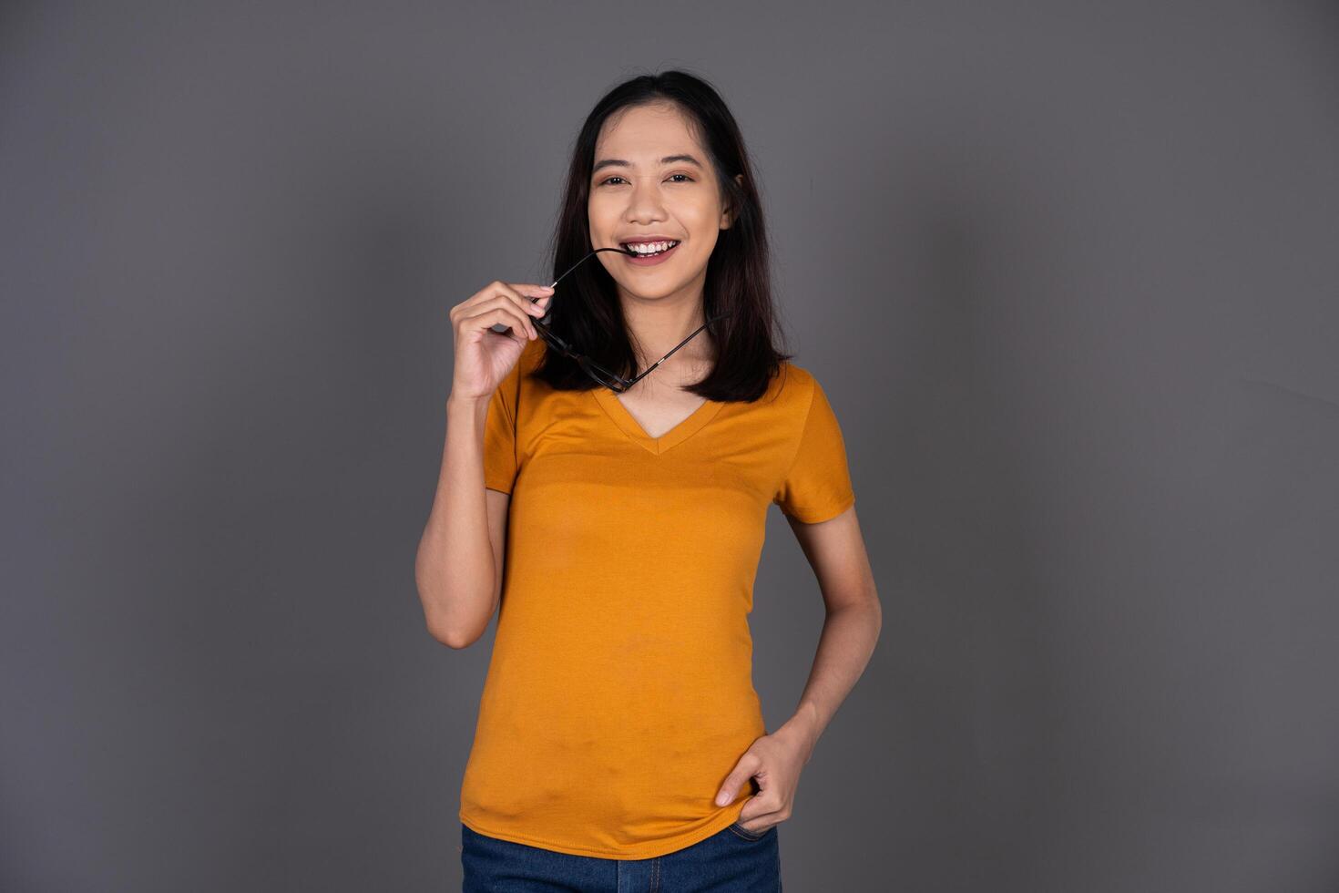 Portrait of a Smiling Female Wearing Glasses with a Cheerful Expression Isolated Background photo
