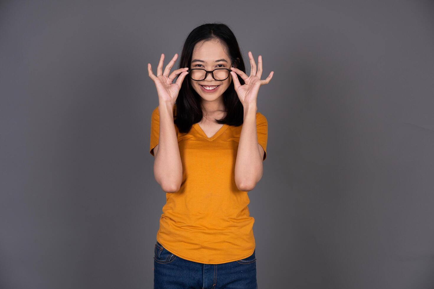 Portrait of a Smiling Female Wearing Glasses with a Cheerful Expression Isolated photo