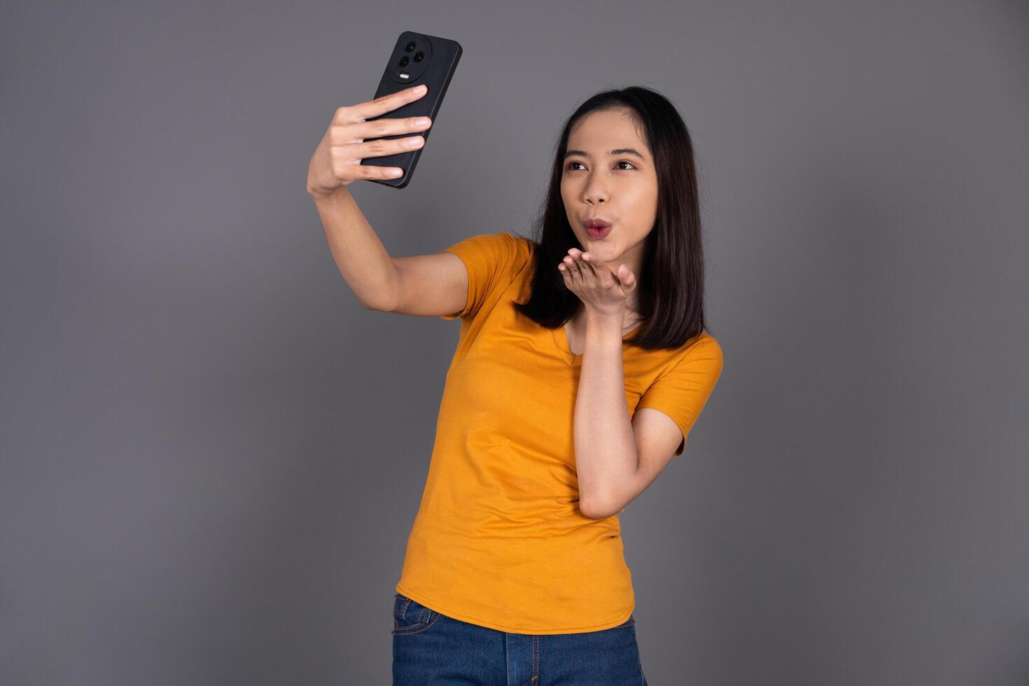 Close-Up of a Woman Smiling Happily While Taking a Selfie Isolated photo