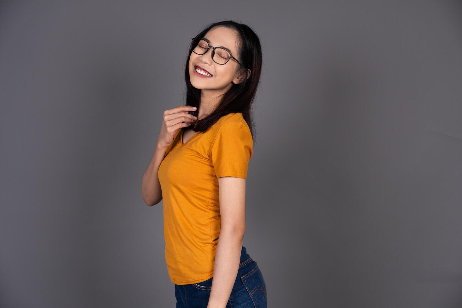 Portrait of a Smiling Girl Wearing Glasses with a Cheerful Expression photo