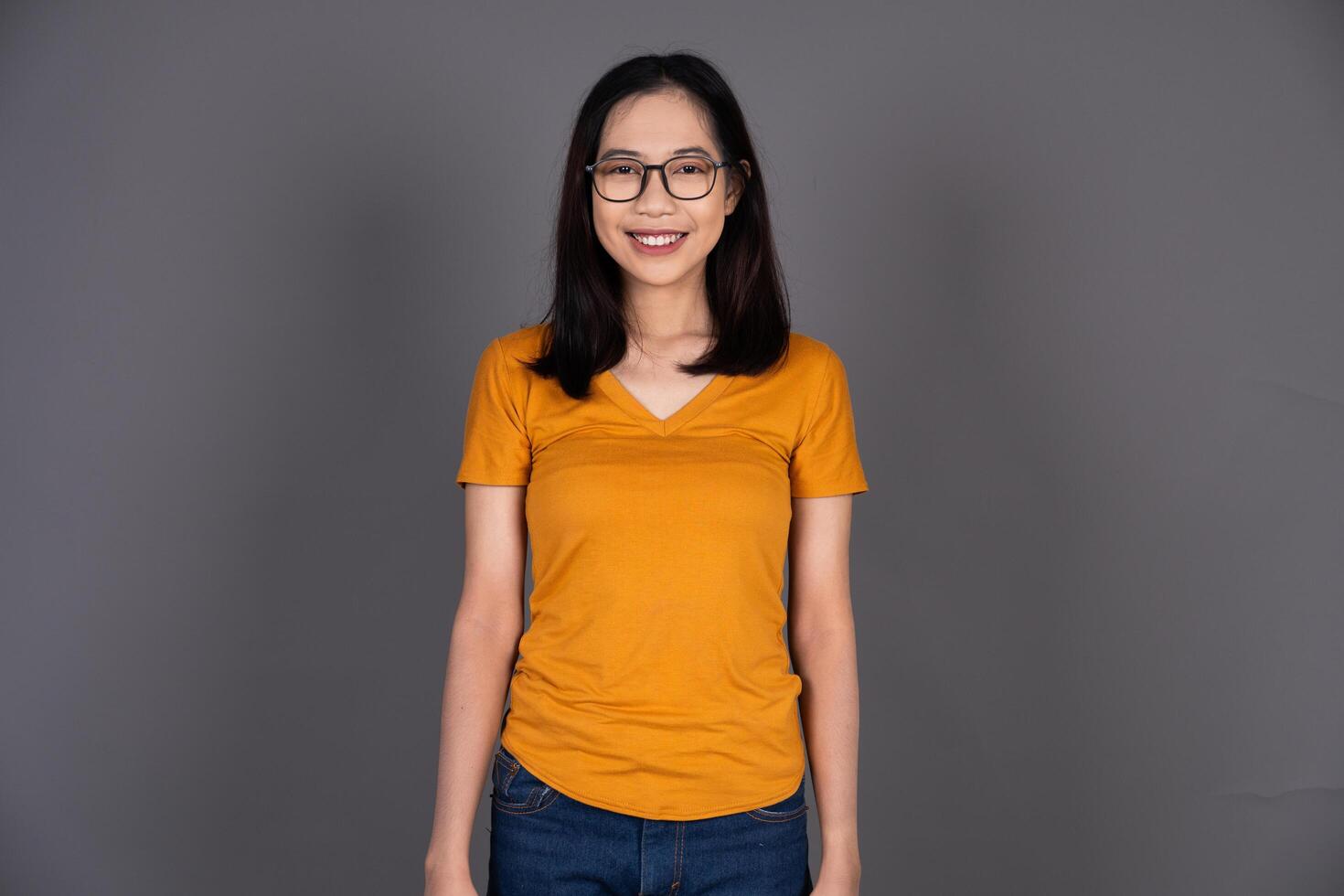 Portrait of a Smiling Woman Wearing Glasses with a Cheerful Expression photo