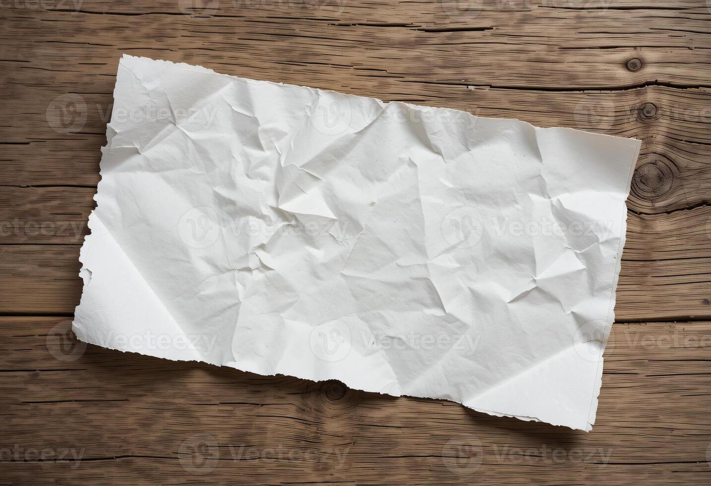 Empty wrinkled white paper texture on weathered oak wood grain table photo