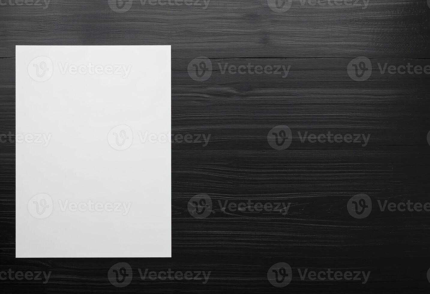 Empty or Blank white A4 paper, Vertical paper with copy space, on black wooden background photo