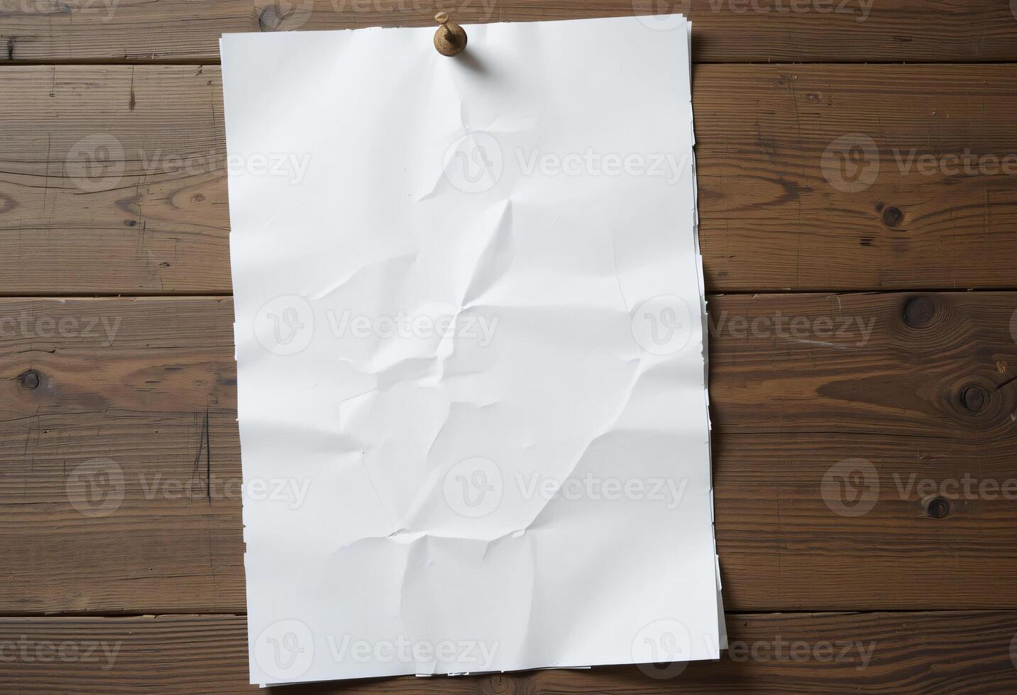 A white A4 sheet, slightly creased, pinned to a wooden surface with a rustic pushpin photo