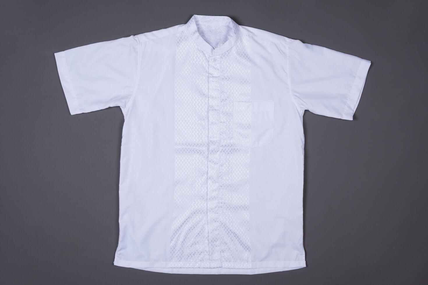 Minimalist White Shirt for Fashion Design Against a Grey Background photo