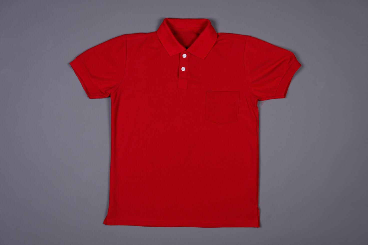Blank Red Polo Shirt for Branding Design on a grey background photo