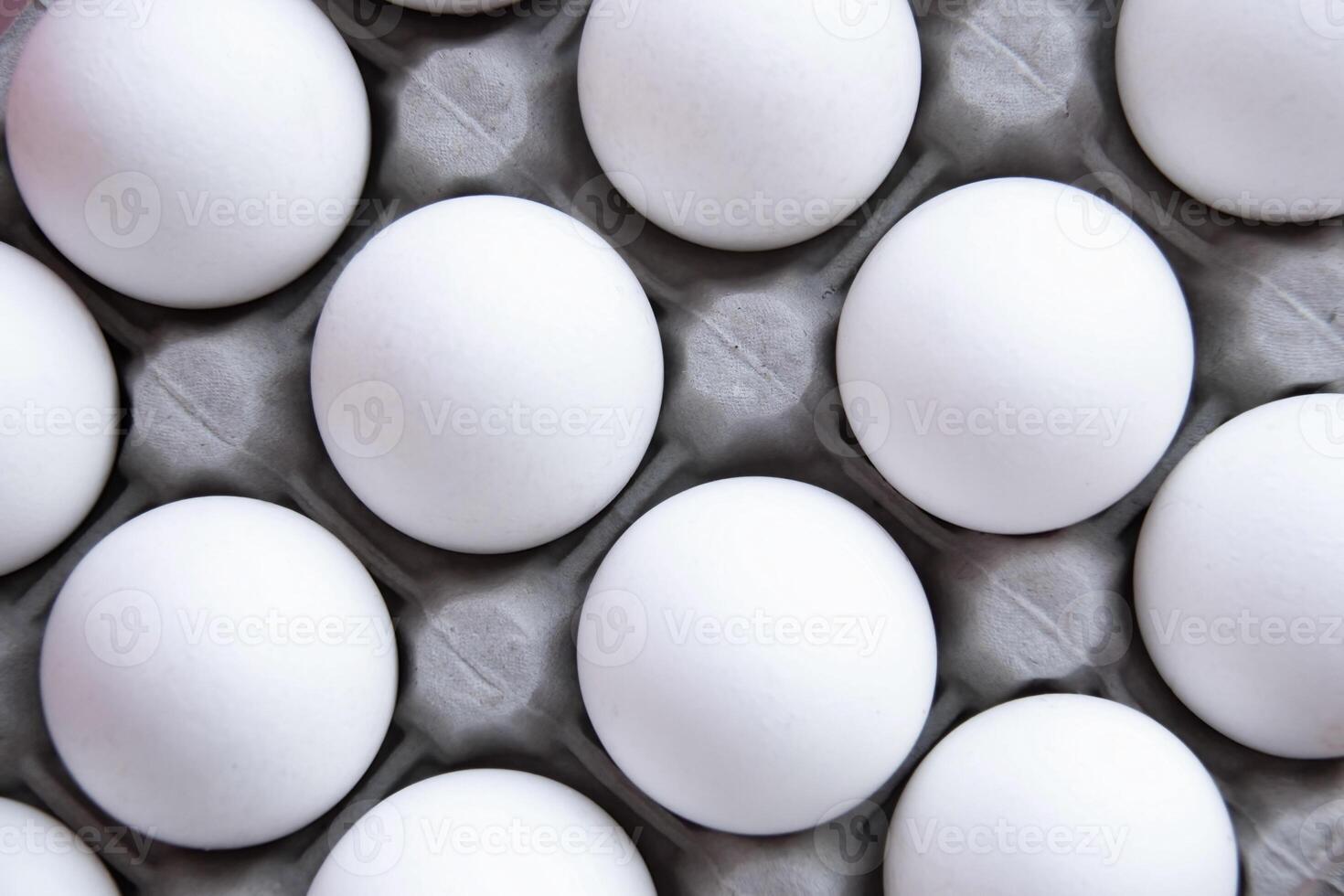 Dozen Fresh White eggs, neatly stacked in Cardboard Tray Top View, create aesthetic Minimalism, Uniformity Purity. Food-related projects, creating corporate identity market decorating kitchen photo