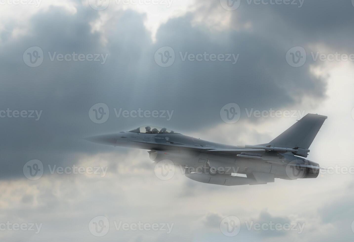 A fighter jet flying through the sky photo