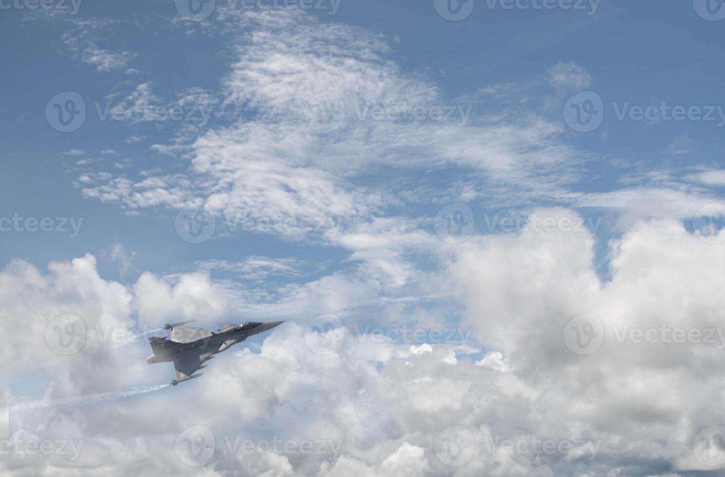 A jet flying through the clouds photo