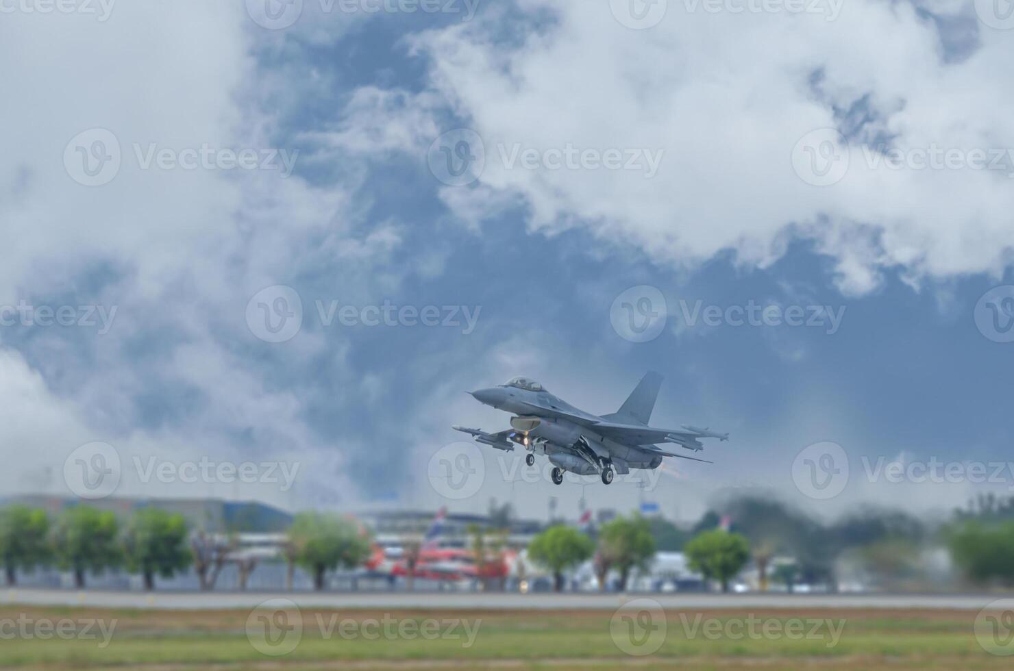 A fighter jet is taking off from an airport photo