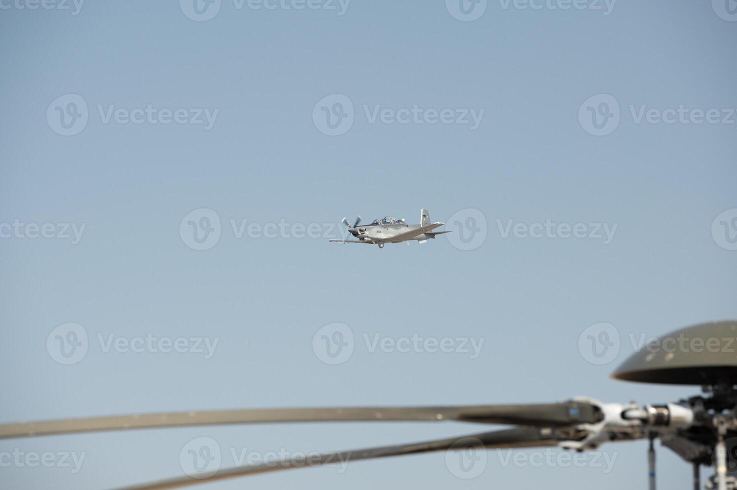 A small plane flying in the sky photo