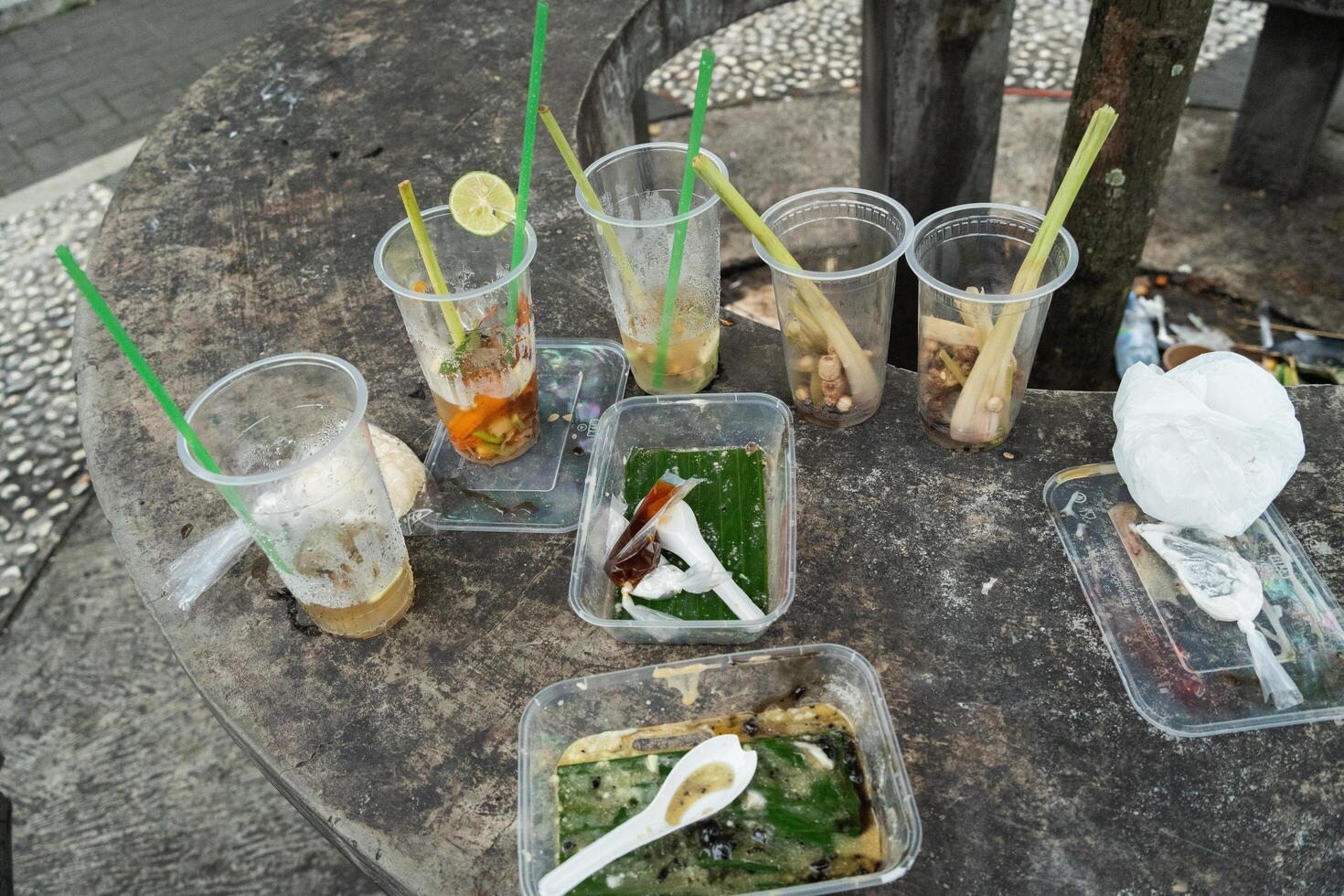 straws and plastic food container, the leftover drinks, things that cause environmental problems in the world photo