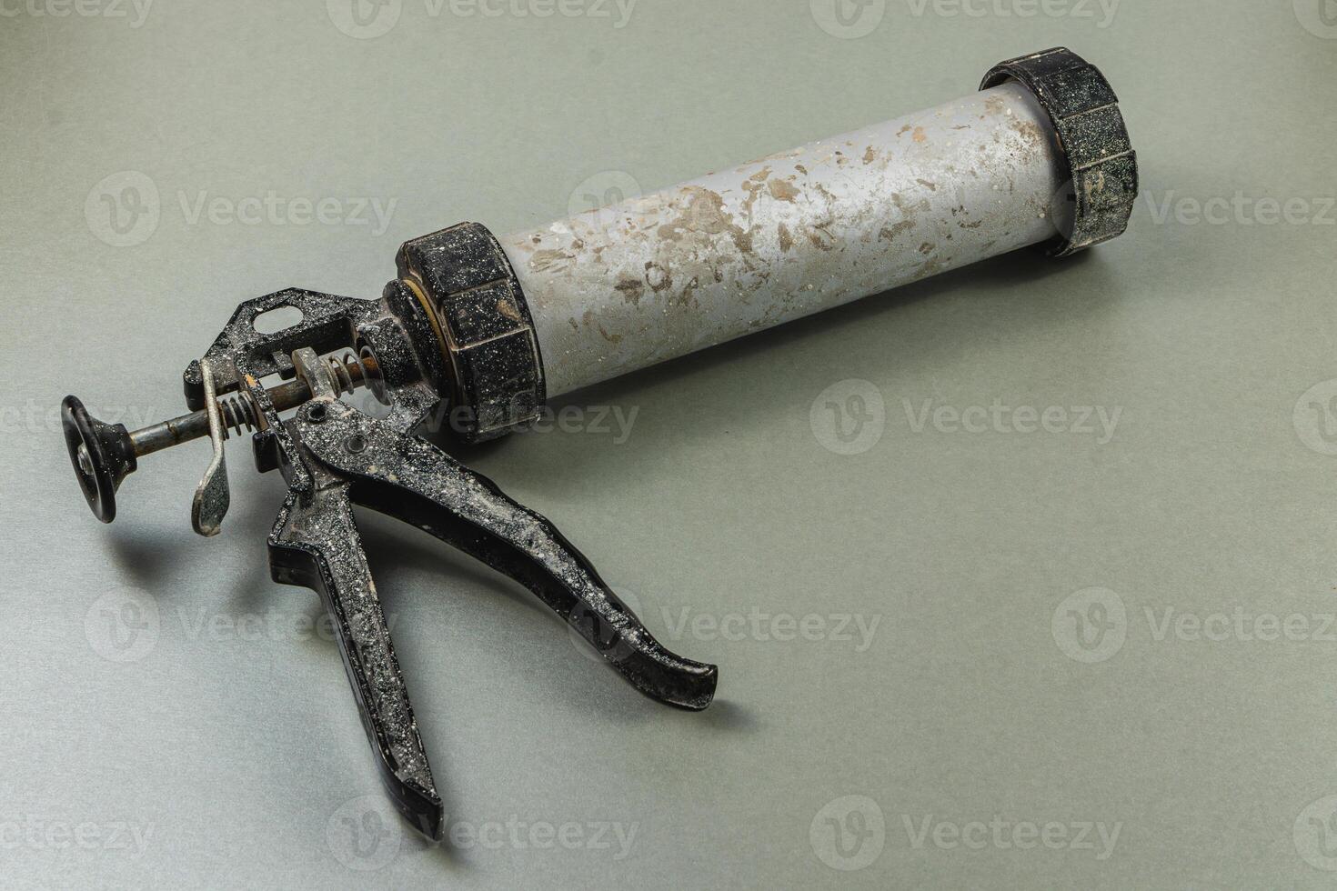 Tool for sealing and applying adhesive in workshop setting photo