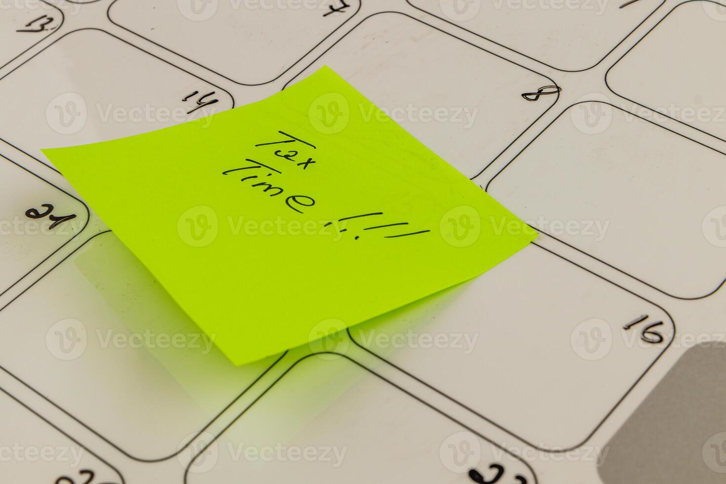 Important tax deadline reminder on a cluttered calendar for individuals photo