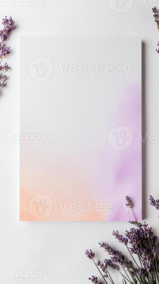 Lavender flowers and a blank white paper on a white background photo