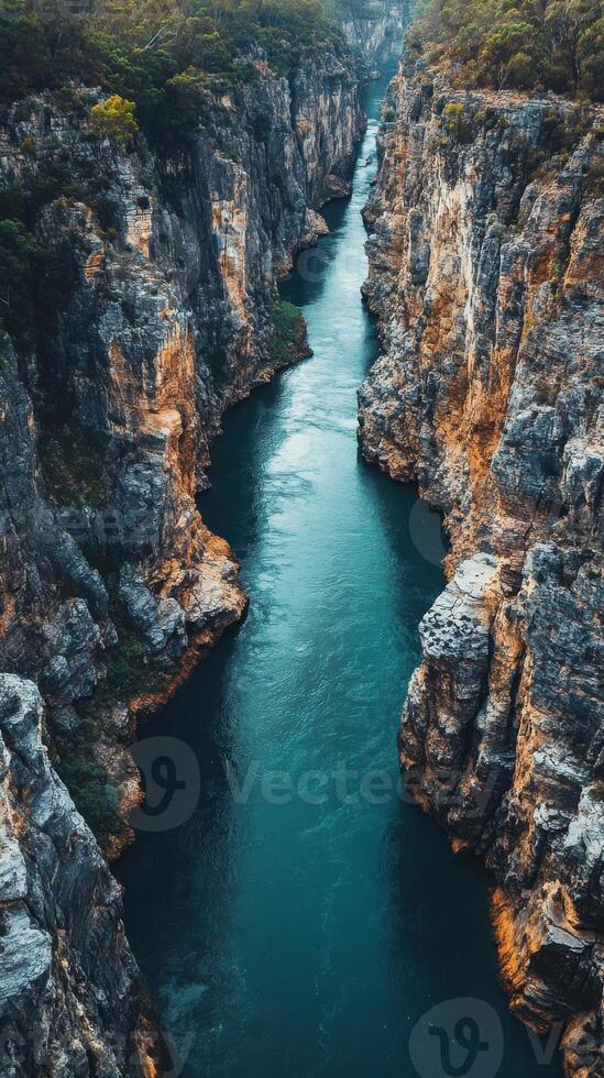 A river flowing through a gorge in the middle of a canyon photo