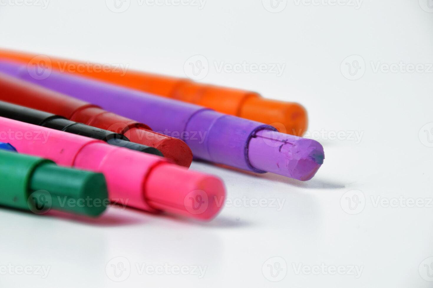 Macro Shot of Vibrant Silky Crayons on White photo