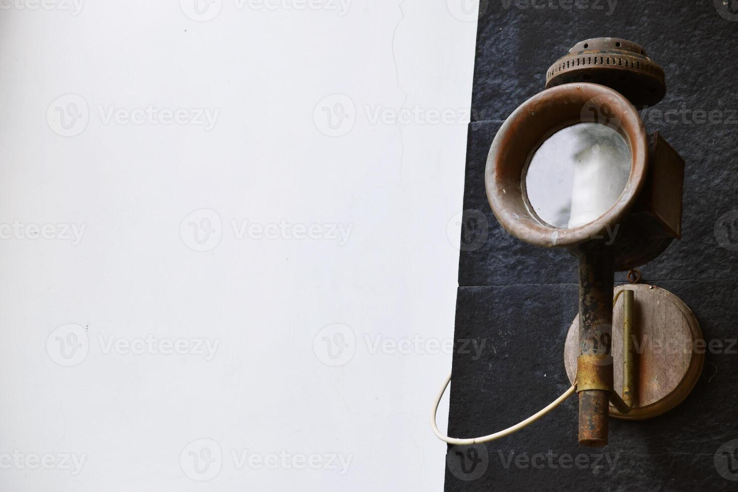 Classic Outdoor Lantern Mounted on Textured Stone photo