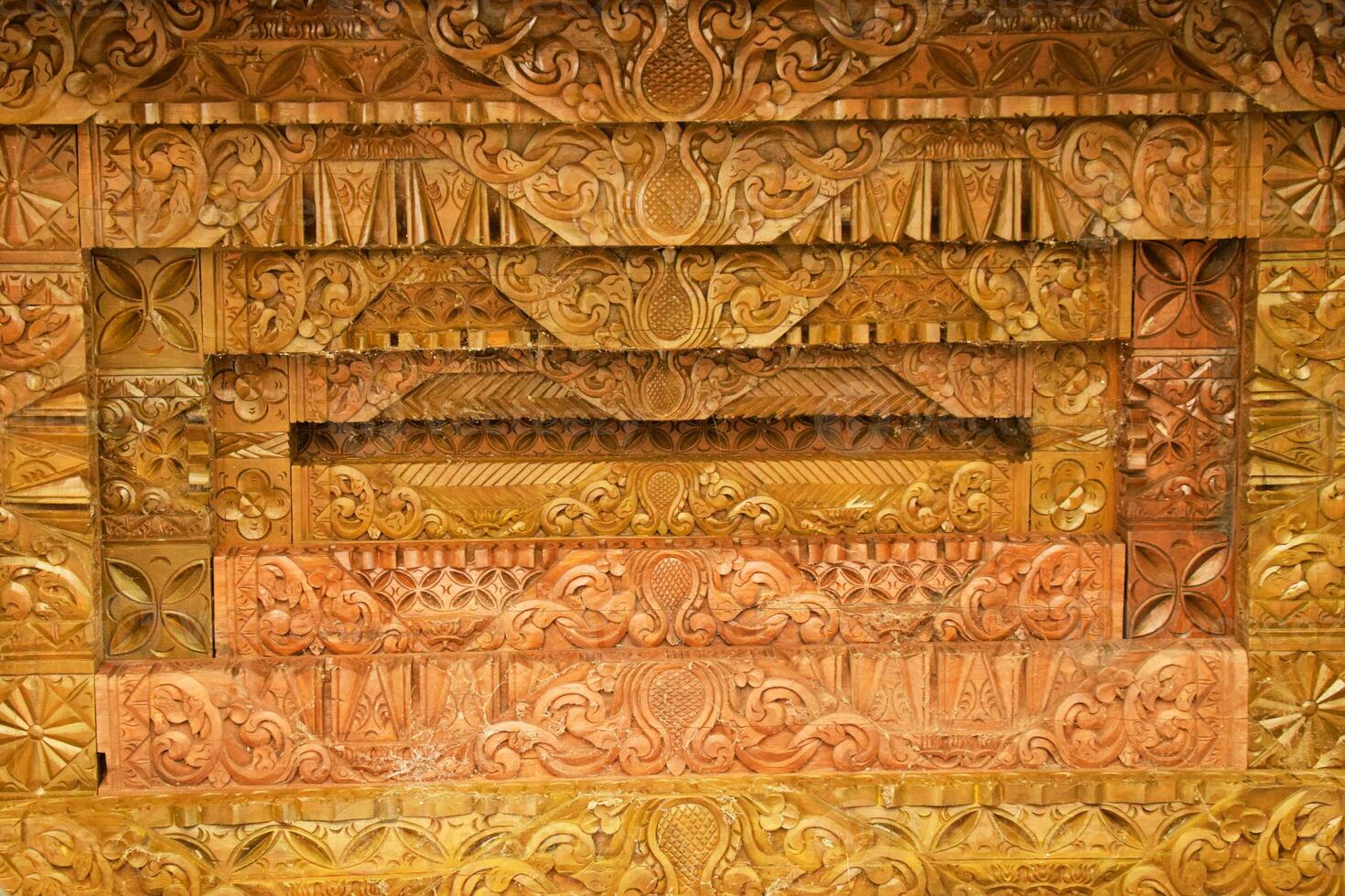 Traditional Javanese Carvings on Joglo Pavilion Ceiling photo