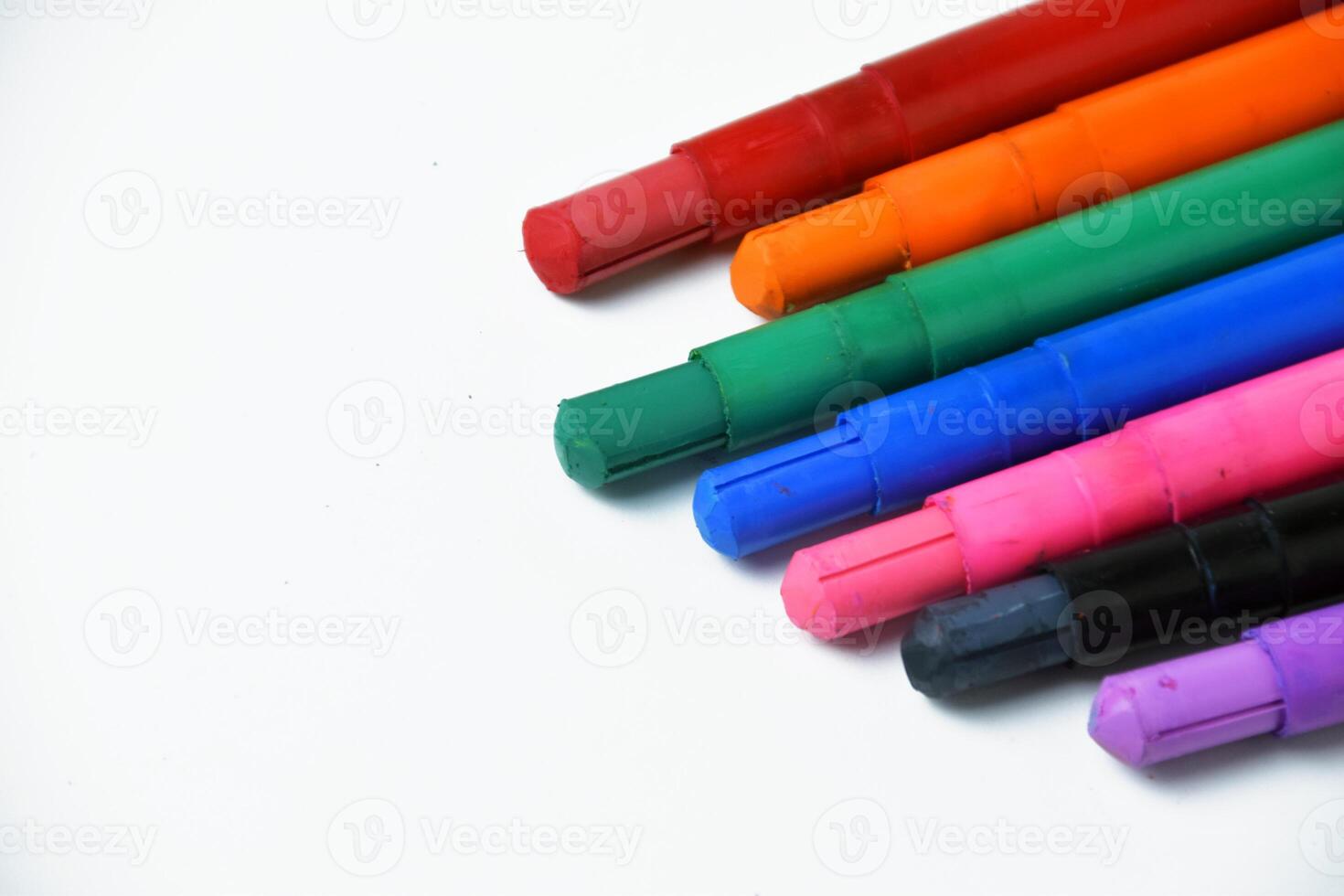 Set of Bright Smooth Crayons on Clean White Backdrop photo