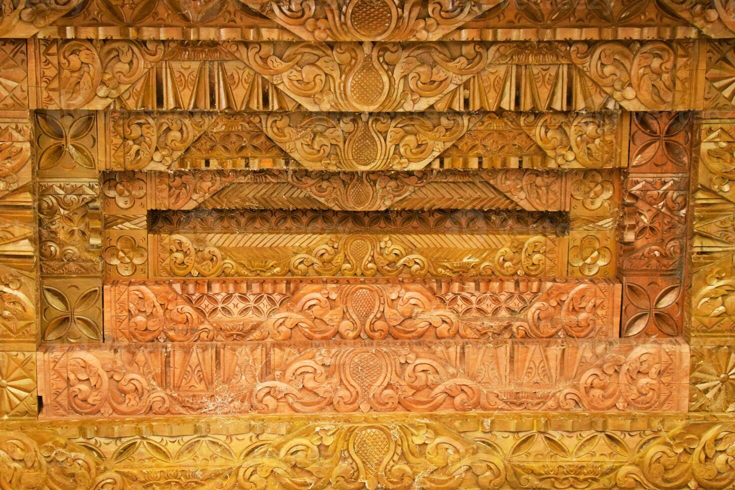 Authentic Javanese Wood Carvings on Joglo Pavilion Roof photo