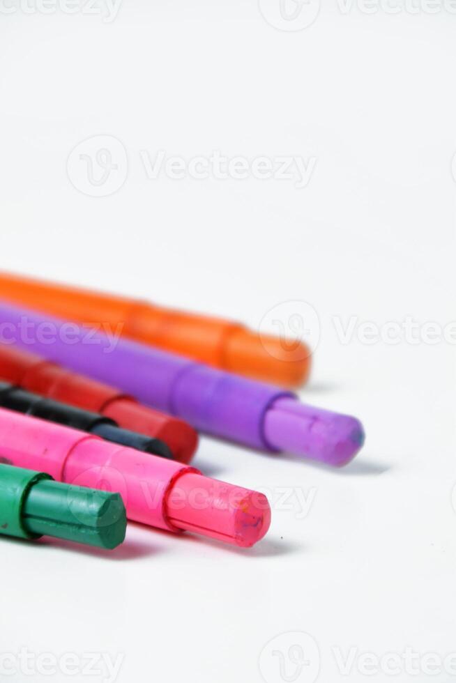 Colorful Drawing Crayon Sticks in Closeup on White photo