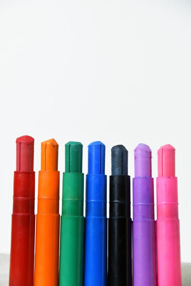 Silky crayons with vivid colors on white photo
