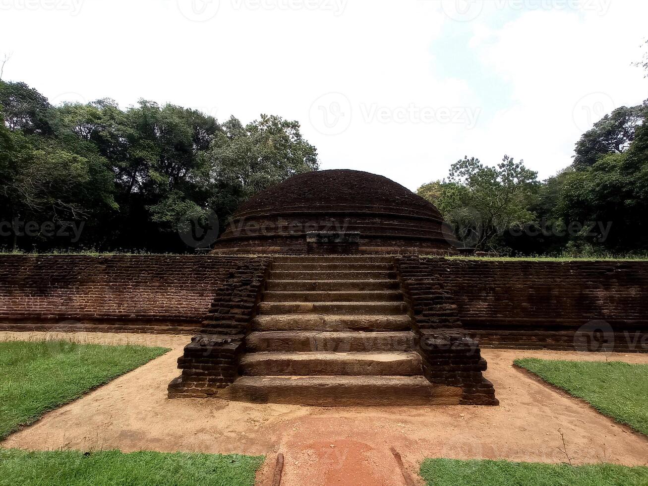 Ancient Stupa ruins in Sigiriya Sri Lanka surrounded by lush greenery and timeless history photo