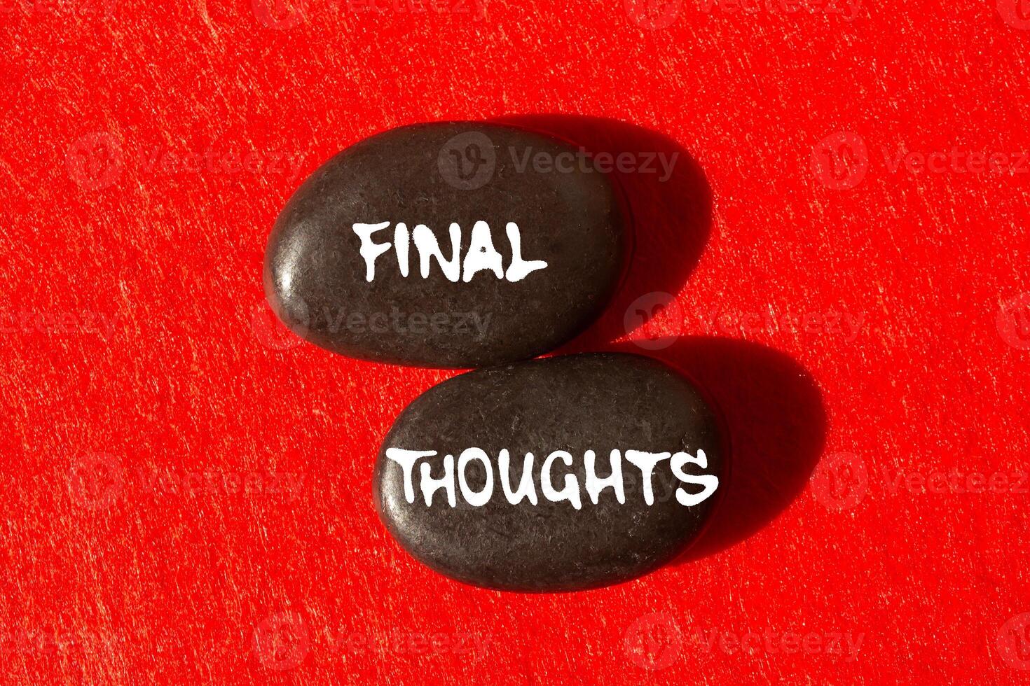 Final thoughts message written on black stones on red background. Conceptual final thoughts symbol. Copy space. photo