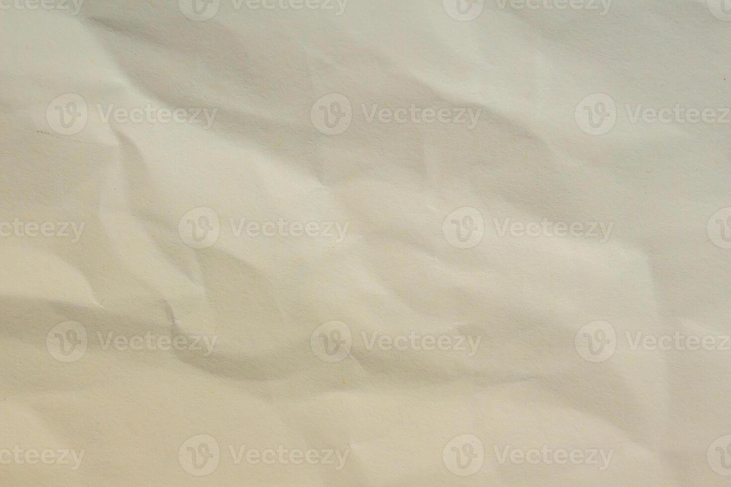 Crumpled paper as background creased craft paper texture blank paper sheet photo