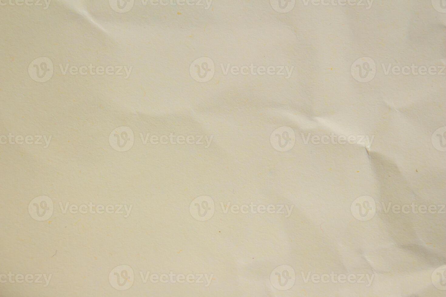 Crumpled or creased paper as background creased craft paper texture design element blank paper sheet photo