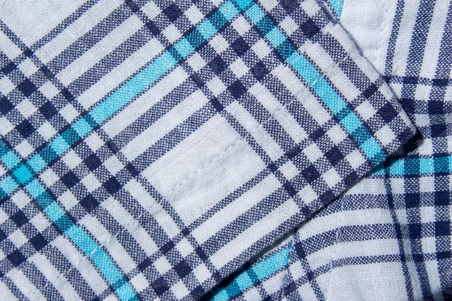 Classic blue and cyan color plaid fabric texture as background photo